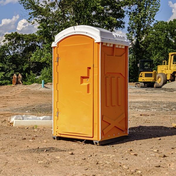 what is the cost difference between standard and deluxe porta potty rentals in Dell Rapids